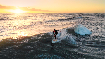 Surfing at sunset Surfing at sunset